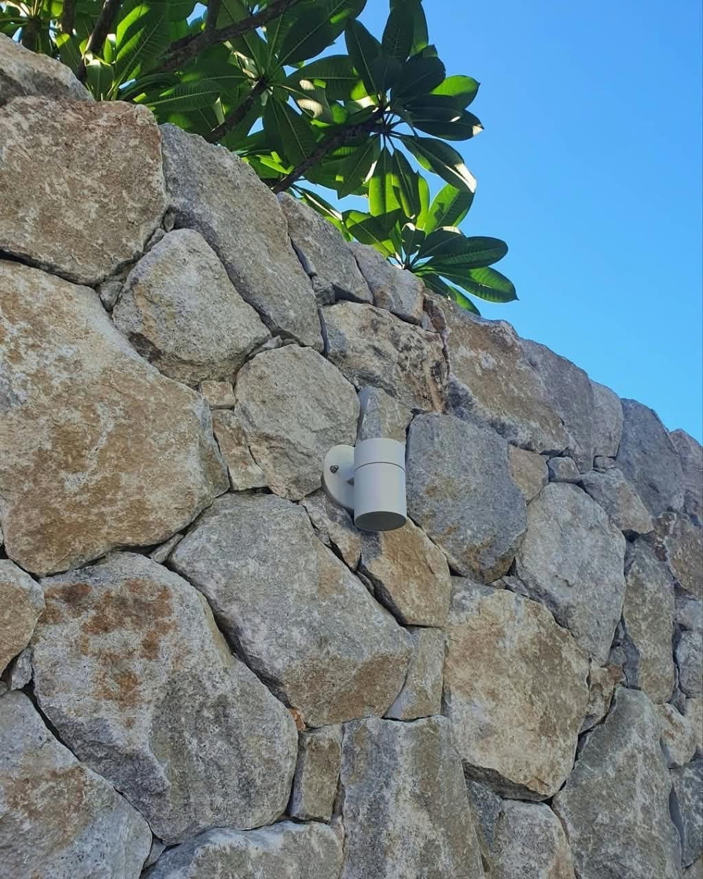 Yellow Pearl Stone Cladding from The Nurso, showcasing textured natural stone panels with a warm yellow pearl finish.