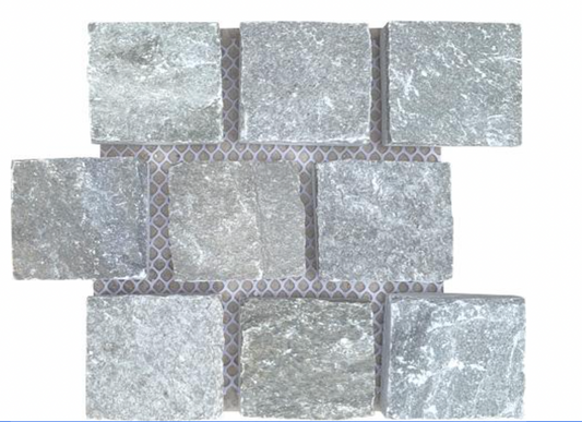 Gray slate cobblestones from The Nurso, showcasing textured natural stone paving for outdoor or landscape use.