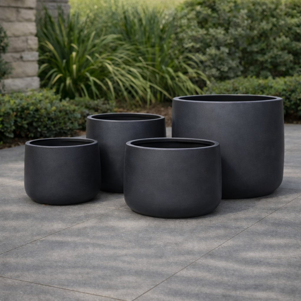 Black Tuscan Drum Pot with a 27cm diameter and 22cm height, featuring a modern, cylindrical design for versatile indoor or outdoor use.