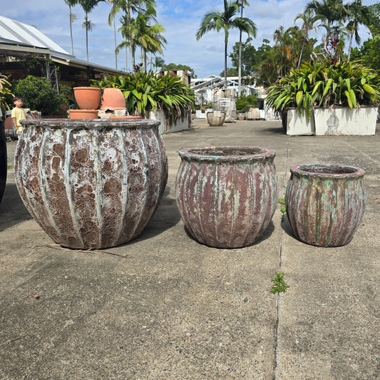 Green and brown vertical ribbed ceramic pot by The Nurso, Atlantis model, measuring 32cm diameter and 35cm height.