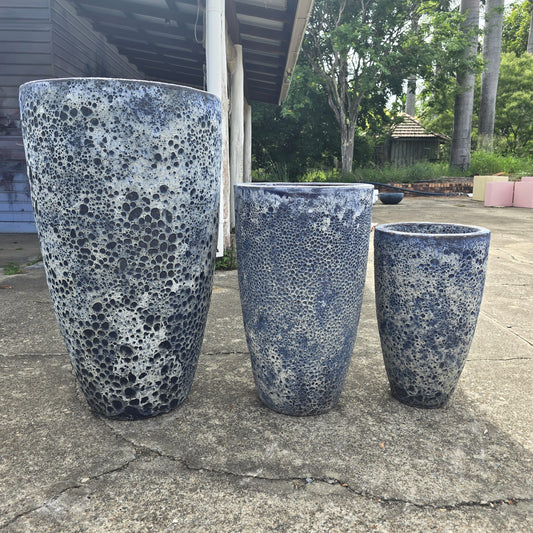 Tall blue Atlantis U-shaped plant pot by The Nurso, 34cm wide and 60cm tall, suitable for indoor or outdoor use.