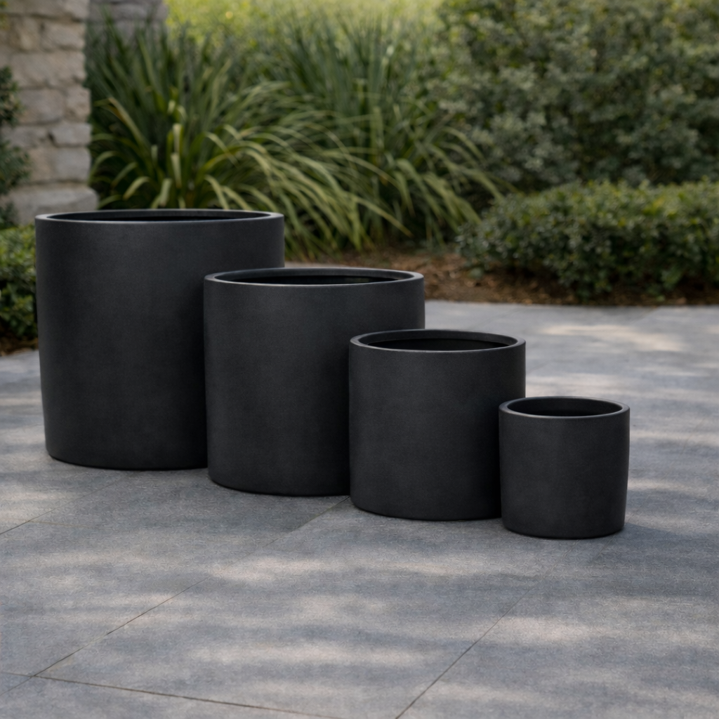 Black Tuscan Cylinder Pot by The Nurso, 35cm tall and wide, with a sleek modern design and textured surface.