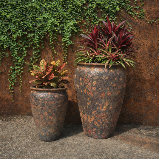 Rust-colored Atlantis Wide Jar Pot by The Nurso, with a large, round ceramic design and wide opening for plants or decorative use.