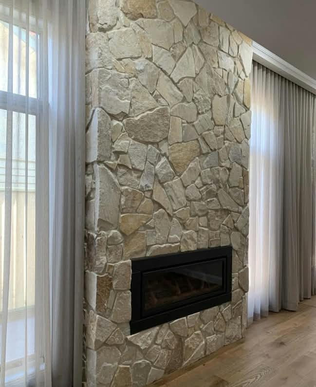 Ivory white quartz wall cladding in a diagonal natural stone pattern by The Nurso, showcasing textured stone tiles for interior or exterior walls.