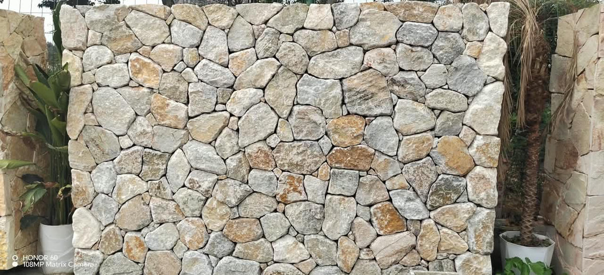 Yellow pearl stone cladding from The Nurso, showing textured, natural pearl-colored stone surface for wall or accent decoration.