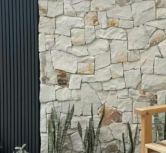 White and rusty sandstone stone wall cladding by The Nurso with textured, layered stone tiles for interior or exterior use.