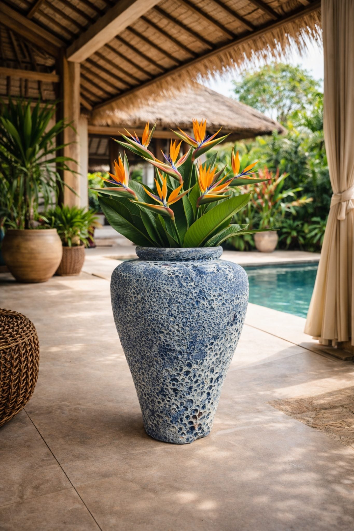 Blue Atlantis narrow jar pot with a sleek, cylindrical design, perfect for decorative or functional indoor plant displays.