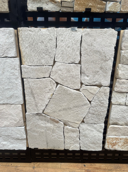 White mixed sandstone from The Nurso, showing textured natural stone with varied shades and rough surface details.