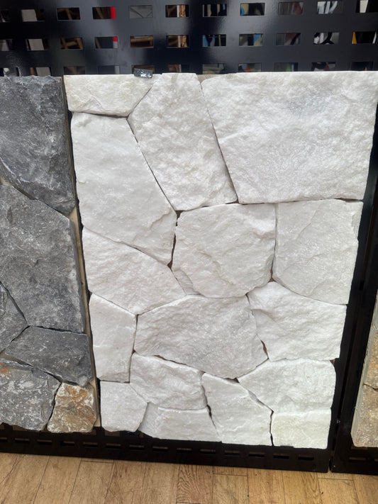 White marble slab from The Nurso with smooth, polished surface and natural veining, ideal for home decor or countertops.