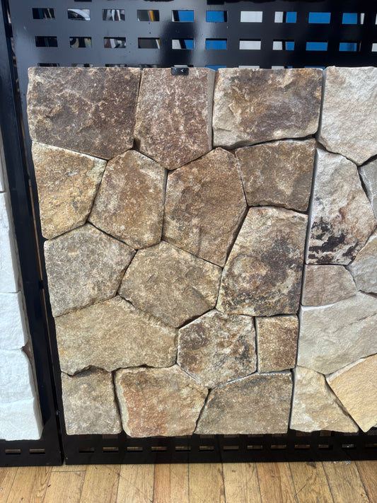 Amber gold sandstone from The Nurso, showcasing smooth, warm-toned mineral with natural textured surface.
