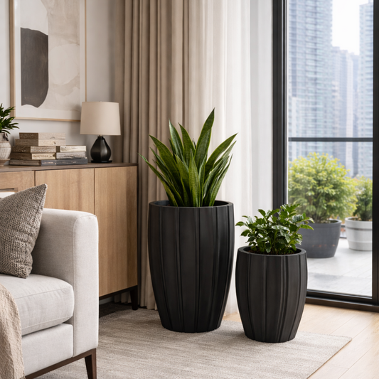 Black Tuscan Carve Pot by The Nurso, featuring intricate carved design and a classic shape suitable for stylish home decor.