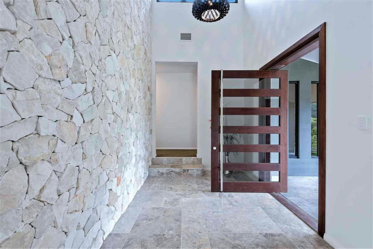 White marble stone cladding from The Nurso featuring polished, rectangular marble tiles with natural veining for interior or exterior walls.