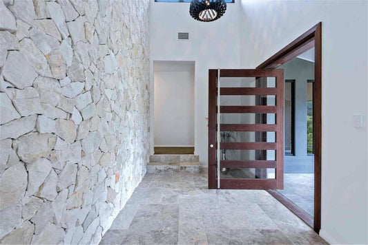 White marble stone cladding from The Nurso featuring polished, rectangular marble tiles with natural veining for interior or exterior walls.