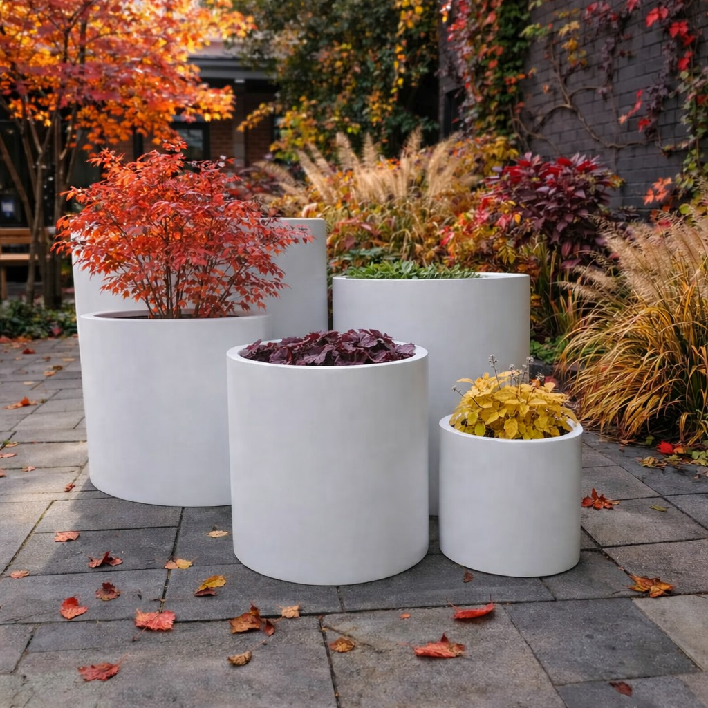 White cedar cylinder pot with a smooth finish, measuring 23cm in height and width, ideal for indoor or outdoor plants.