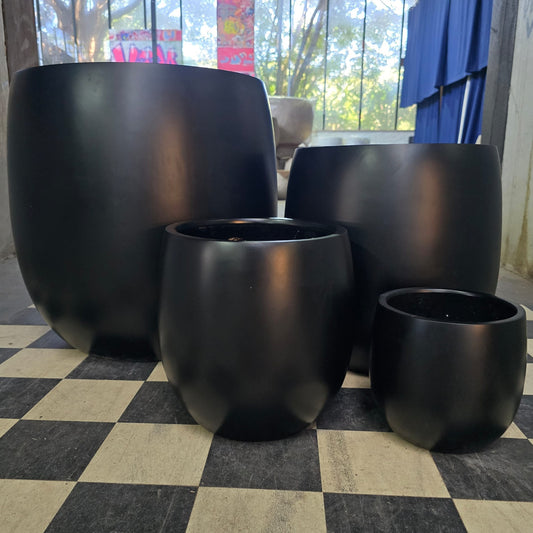 Close-up of Cedar New Cigar Black by The Nurso, showing the sleek black cigar with cedar wrapper and detailed craftsmanship.