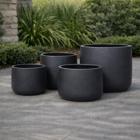 Black Tuscan Drum Pot with a 27cm diameter and 22cm height, featuring a modern, cylindrical design for versatile indoor or outdoor use.