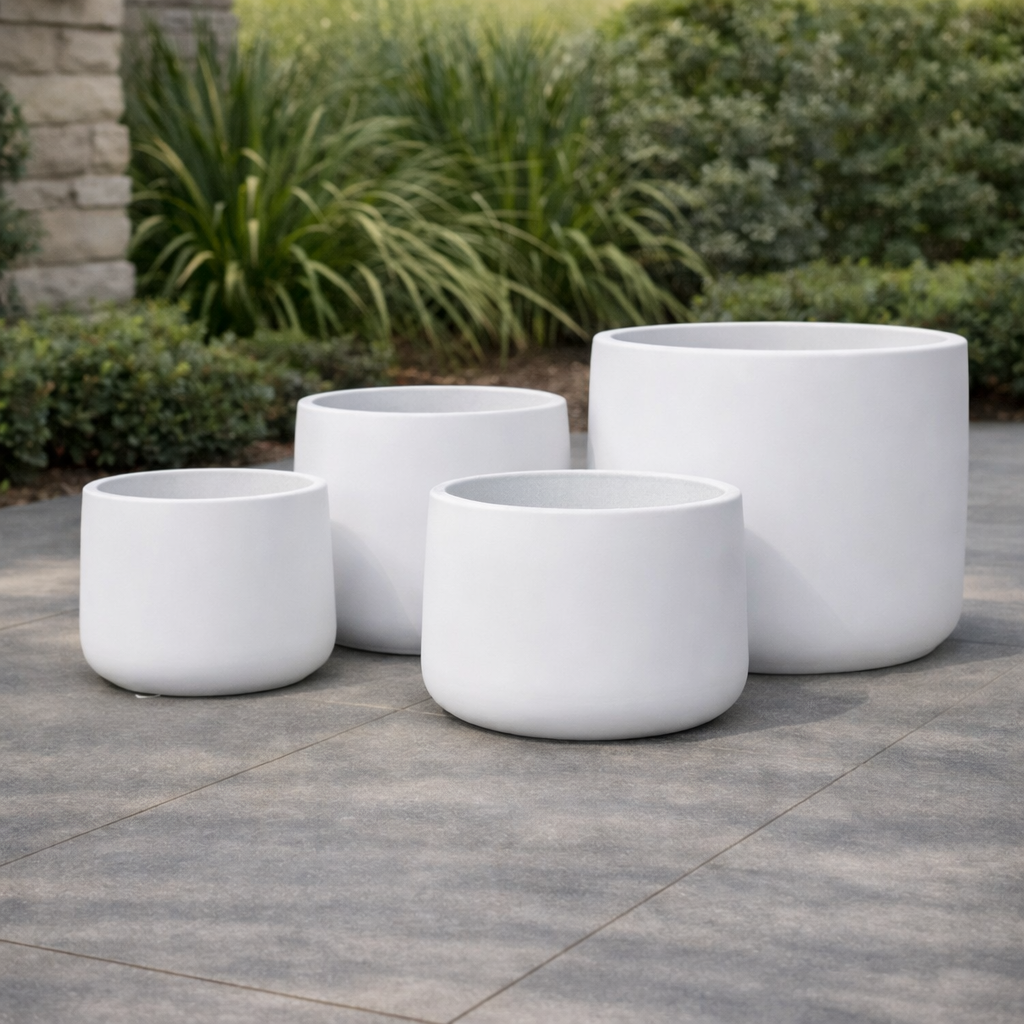 White Tuscan Drum by The Nurso, featuring a smooth, glossy surface and elegant cylindrical design.