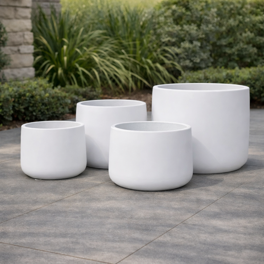 White Tuscan Drum by The Nurso, featuring a smooth, glossy surface and elegant cylindrical design.