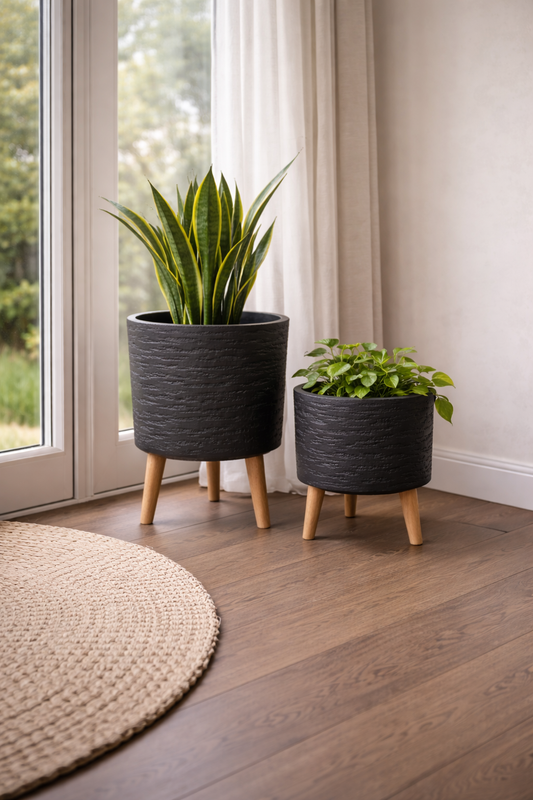 Black Tuscan Cylinder Tripod Pot by The Nurso, 27cm wide and 35cm high, showcasing a stylish ceramic planter with tripod stand.