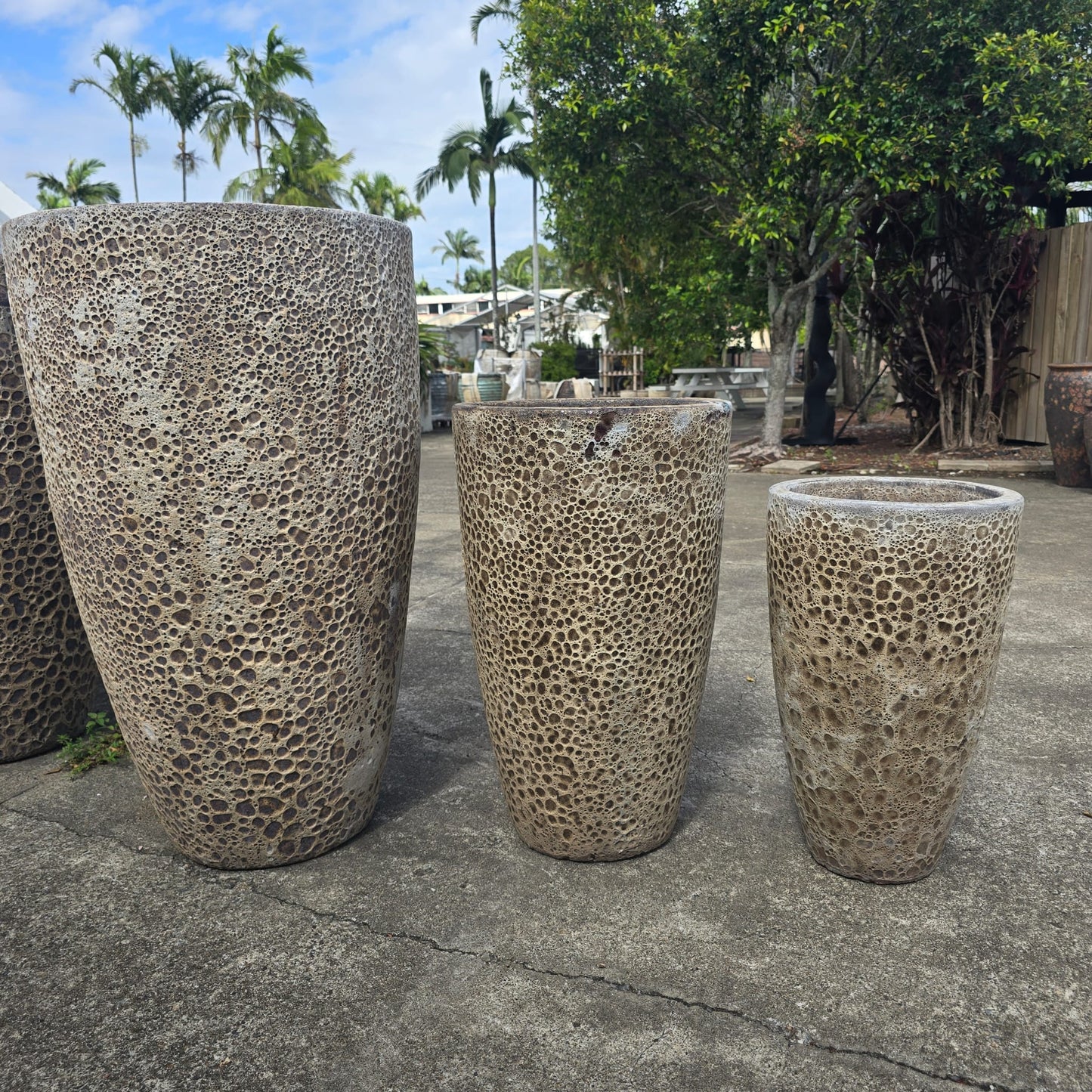 Tall U-shaped cream-colored ceramic planter by Atlantis with a modern design, measuring 34cm wide and 60cm high.